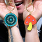 mushroom and saw blade enamel keychain