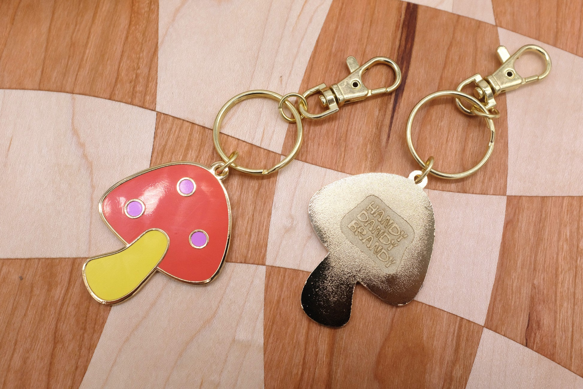 mushroom and saw blade enamel keychain