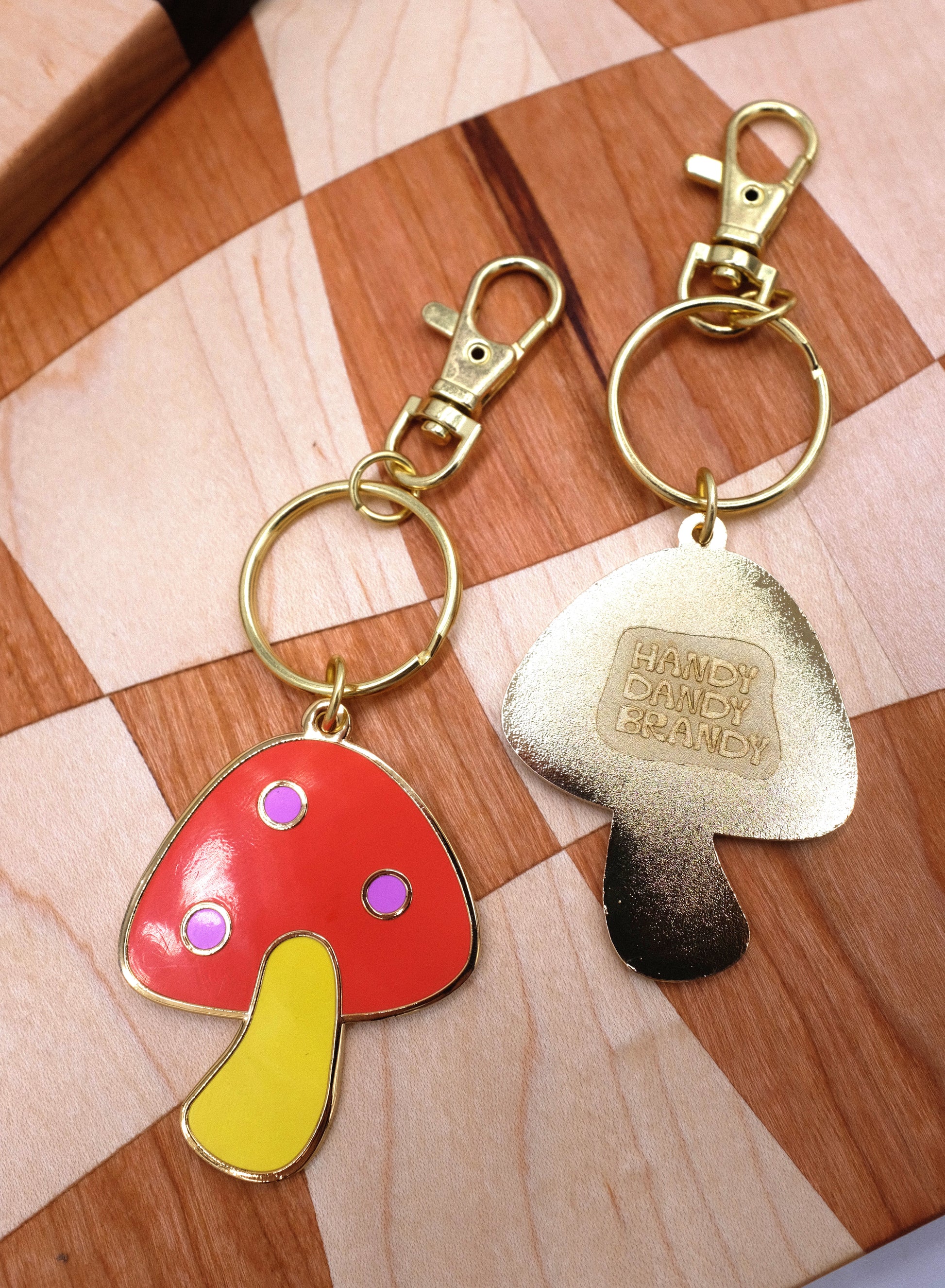 mushroom and saw blade enamel keychain