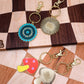 mushroom and saw blade enamel keychain