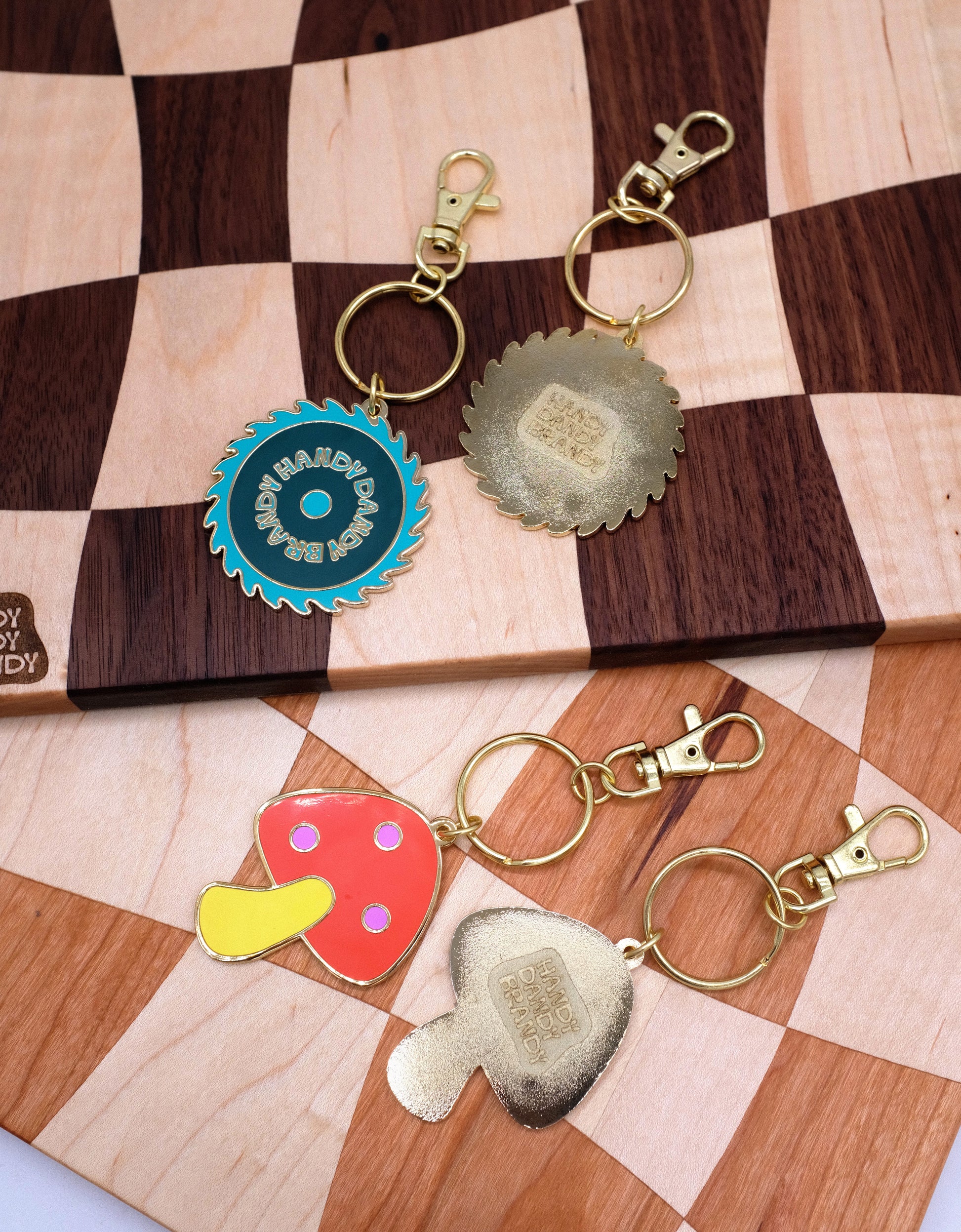 mushroom and saw blade enamel keychain