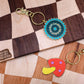 mushroom and saw blade enamel keychain