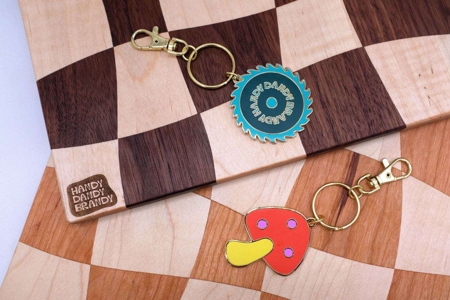 mushroom and saw blade enamel keychain