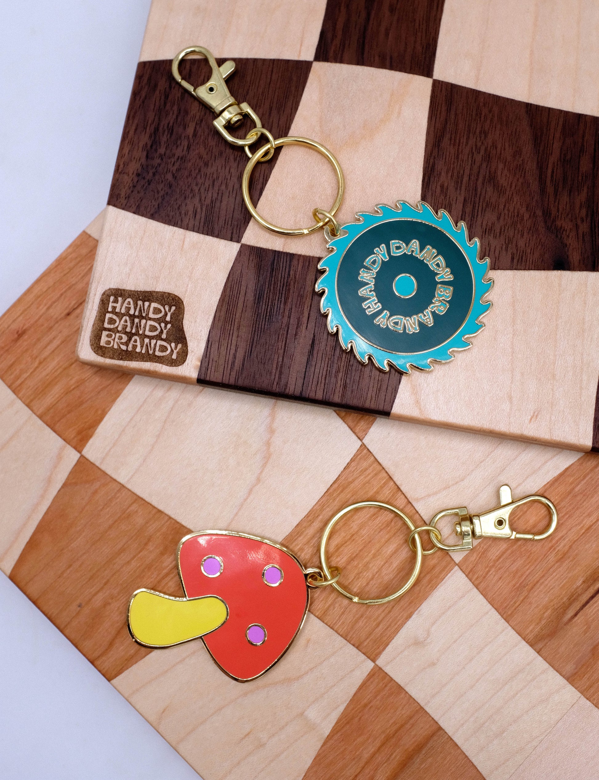 mushroom and saw blade enamel keychain