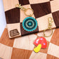 mushroom and saw blade enamel keychain