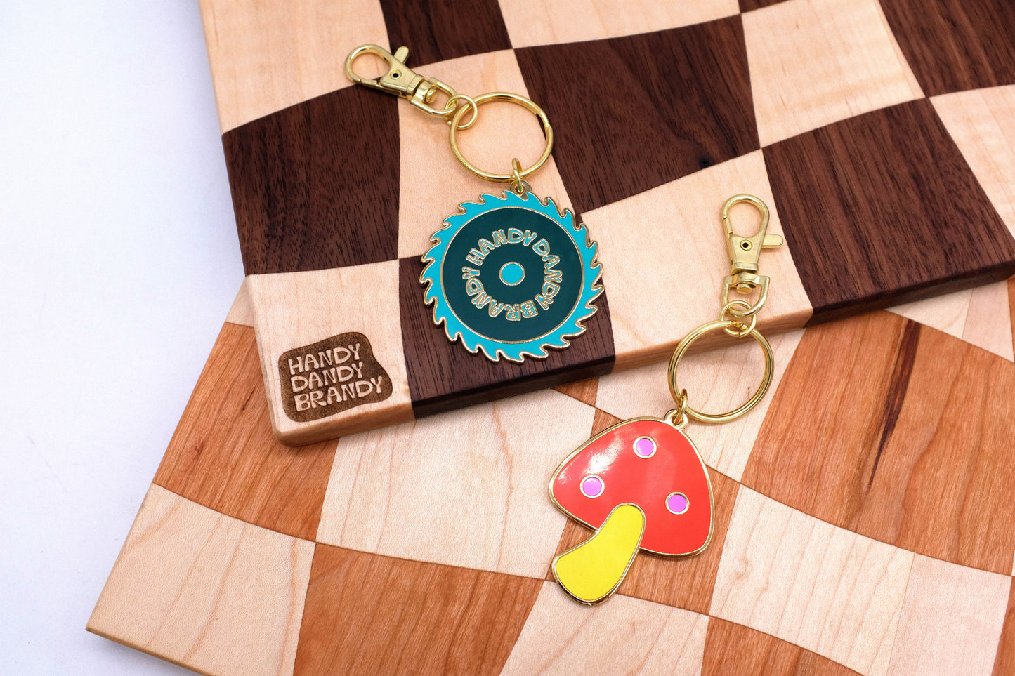 mushroom and saw blade enamel keychain