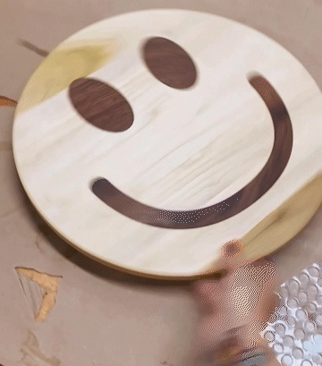smiley face shaped lazy susan made of poplar